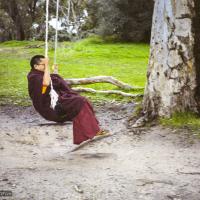 Lama Zopa Rinpoche swinging in Adelaide, Australia, 1983. Photo: Wendy Finster.