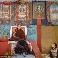 (10237_ng-3.JPG) Lama Yeshe giving final teaching at Sixteenth Kopan course, Kopan Monastery, Nepal, 1983. Karuna Cayton at the foot of the teaching throne. Photo by Wendy Finster.