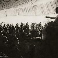 (10456_pr-2.psd) Lama Yeshe teaching in the tent, Kopan Monastery, Nepal, 1974. For the Seventh Meditation Course a huge Indian wedding tent replaced the dusty burlap-walled tent.