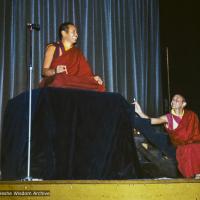 (12315_ud-3.jpg) Lama Yeshe giving a public talk (with Nick Ribush at the right), Melbourne University, Australia, 1975.