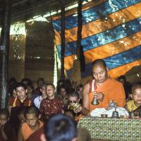 (12753_sl.tif) Lama Yeshe doing puja. Next to Lama Yeshe is Gelek Gyatso, and Charok Lama (Tenzin Dorje). On the left is Thubten Wongmo (Feather Meston), Thubten Pemo (Linda Grossman), Aleca Moriatis, and Nicole Couture. Photo from the 8th Meditation Course at Kopan Monastery, Nepal, 1975.