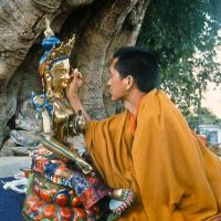 (12906_sl-3.psd) Lama Zopa Rinpoche painting Tara, Kopan Monastery, Nepal, 1976. Lama Yeshe sent Max Mathews to buy a large Tara statue in Kathmandu, which was eventually placed in a glass-fronted house on a pedestal overlooking a triangular pond that was built under the ancient bodhi tree in front of the gompa, Kopan Monastery, Nepal. Photo by Peter Iseli.