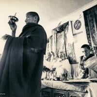 (13303_pr-2.psd) Lama Zopa Rinpoche doing puja (spiritual practice) during the Fourth Meditation Course, Kopan Monastery, Nepal, 1973. Photo by Brian Beresford.