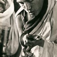 (13305_pr-2.psd) Lama Zopa Rinpoche doing puja (spiritual practice) during the Fourth Meditation Course, Kopan Monastery, Nepal, 1973. Photo by Brian Beresford.