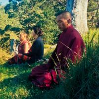 (13330_pr-2.psd) Lama Yeshe, Beatrice Ribush, and Lama Zopa Rinpoche in meditation. On Saka Dawa (the celebration of Buddha's birth, enlightenment, and death), Lama Yeshe asked everyone to come outside after a Guru Puja for a meditation on the hill behind the gompa. Chenrezig Institute, Australia, May 25, 1975. Photo by Wendy Finster.