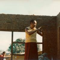 (13533_pr3.psd) Lama Yeshe supervising the construction of an addition above the
kitchen/office complex. Kopan Monastery, Nepal, 1974.