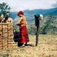 (13536_pr2.jpg) The first bricks to build Kopan Monastery, 1971 (The Monk is named Dennis, the student to his left is unknown.)