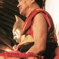 (13550_sl-3.JPG) Lama Yeshe (with statue of Lama Tsongkhapa in background) teaching the Yogas of Naropa at Istituto Lama Tzong Khapa, 1982. Dieter Kratzer (photographer)