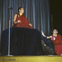 Lama Yeshe giving a public talk (with Nick Ribush at the right), Melbourne University, Australia, 1975.