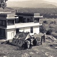 Click to view in our Image Gallery (15144_ng.psd) The construction of Kopan, second floor complete, rear view, 1972. Students and workers gather by the dining tent. Kopan Monastery, built in Nepal, is the first major teaching center founded by Lama Yeshe and Lama Zopa Rinpoche.