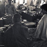 (15160_ng.psd) Mount Everest Center at Kpoan Monastery, 1972: installing the portrait of His Holiness the Dalai Lama in the Kopan Gompa. Lama Yeshe and Lama Zopa with other monks offering prayers.