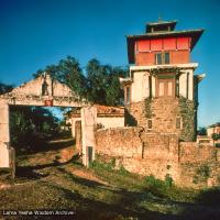 (15168_sl.psd) The front gate at Kopan showing Steve's Tower on the right. Steve Malasky, an American student, built a Tibetan tower at one end of the Kopan land which came to be known as "Steve's Tower".