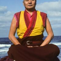 Lama Yeshe meditating by the ocean, Sicily, 1983. Photo: Jacie Keeley