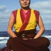 Click to view in our Image Gallery Lama Yeshe meditating by the ocean, Sicily, 1983. Photo: Jacie Keeley