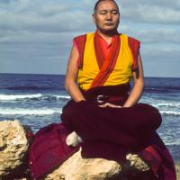 Lama Yeshe meditating by the ocean, Sicily, 1983. (Photo Jacie Keeley)