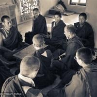 (15471_ng.psd) Lama Yeshe, Lama Zopa Rinpoche, Lama Lhundrup, and Lama Pasang with new monastics including Nick Ribush and Yeshe Khadro (Marie Obst) in the gompa (shrineroom) at Kopan Monastery, Nepal, 1974.