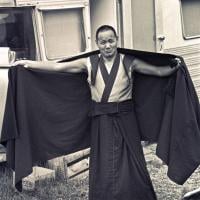 (15920_ng.psd) Lama Yeshe  adjusts his robe  during the month-long course at Chenrezig Institute, Australia, 1975.