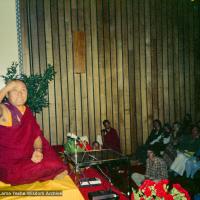 (15973_ng.tif) Lama Yeshe giving a public talk, Adyar Theater, Sydney, Australia, 8th of April, 1975.  Lama Zopa Rinpoche can be seen sitting by the wall.