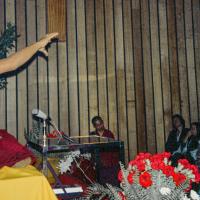 (15974_ng-3.psd) Lama Yeshe giving a public talk, Adyar Theater, Sydney, Australia, 8th of April, 1975. Lama Zopa Rinpoche can be seen sitting by the wall.