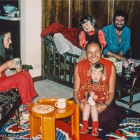 (18895_pr-3.psd) Lama Yeshe at home with the Feldmanns, Melbourne, AU, 1979. Lila Feldmann is on Lama's knee. Rita Feldmann (donor)