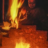 Lama Yeshe performing a fire puja at Tushita Retreat Centre, Dharamsala, India, 1983.