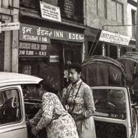 (15071_ng-2.psd) Max Mathews and her Volkswagen outside Eden Hash Shop in Kathmandu, Nepal, 1970. Another nearby hot spot was a cafe called The Blue Tibetan where Lama Yeshe sometimes went for tea and to practice his hippie English.