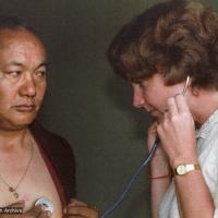 (23036_ng-3.psd) Jacie Keeley listening to Lama Yeshe's heart, Bodhgaya, India, 1982.