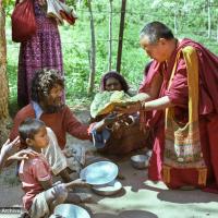 (23283_ng-3.psd) Beggars' banquet, Bodhgaya, India, 1982. Lama Yeshe feeding people on the street.