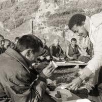 (25211_ng-3.TIF) Max serving Rinpoche after Christmas puja, Kopan Monastery, 1972.