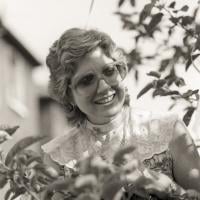 (25275_ng-3.TIF) Jacie Keeley at a teaching with Lama Zopa Rinpoche outdoors at Manjushri London (currently Jamyang Buddhist Centre), 1983. Robin Bath (photographer)