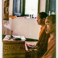 (36901_pr-3.psd) Lama Yeshe doing puja in Zina’s room, Losang Chonjor, right, Kopan Monastery, 1972. Jan Willis (donor-photographer)