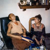 (39289_pr-3.psd) Lama Yeshe and Gabe Wallace, Melbourne, 1974.  Gabe Wallace (donor). Pete Northend: “I walked into our small flat and it was really crowded. Bea Ribush was there and Colin Crosbie, Pete and Gabe. It’s a very small flat and you couldn’t overlook anybody. So I stood there with the flagon under my arm while they all looked at me and packed up laughing. What I didn’t know was that Lama Yeshe was sitting right beside me with his zen pulled over his face. Somehow that had made him inv