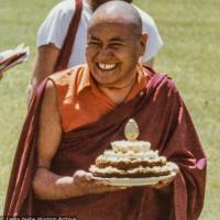 (39392_pr-3.psd) Lama Yeshe holding the cheesecake shaped like a mandala offered to him by Kalleen Mortensen at the teachings at Deer Park, Madison, Wisconsin, 1978. Morgan Groves (photographer)