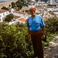 (39566_sl-3.jpg) Lama Yeshe in street clothes, rainbow visor, Lisbon, Portugal, 1983.