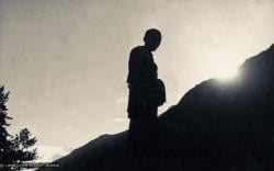 (07629_pr-2.psd) Silhouette of Lama Zopa Rinpoche on the mountainside, Lawudo Retreat Centre, Nepal, 1973.