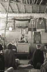 (07719_ng-2.psd) Lama Zopa Rinpoche doing mandala offering during the 9th Meditation Course, Kopan Monastery, Nepal, 1976.