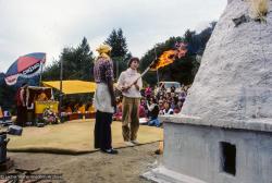 (10084_sl.JPG) An attendee lights the fire. Cremation of Lama Yeshe at Vajrapani Institute, California in March of 1984. Photo by Ricardo de Aratanha.