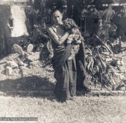 (12441_pr.jpg) Lama Yeshe holding a dog, Nepal, 1970. Sylvia White (donor)