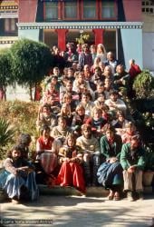 (12741_sl-2.psd) Group sitting with Lama Yeshe on the monastery steps, Kopan Monastery, Nepal, 1976. Photo includes Bill Kane, Harry Sutton, Dharmawati, Steve Ginsburg, Roger Munroe, George Churinoff, Xavi Alongina, Bruce Heavenor, Tom & Shirley Begley, Hester Roos, and Thubten Wongmo.