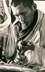 (13305_pr-2.psd) Lama Zopa Rinpoche doing puja (spiritual practice) during the Fourth Meditation Course, Kopan Monastery, Nepal, 1973. Photo by Brian Beresford.