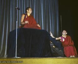 Lama Yeshe giving a public talk (with Nick Ribush at the right), Melbourne University, Australia, 1975.