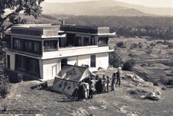 (15144_ng.psd) The construction of Kopan, second floor complete, rear view, 1972. Students and workers gather by the dining tent. Kopan Monastery, built in Nepal, is the first major teaching center founded by Lama Yeshe and Lama Zopa Rinpoche.