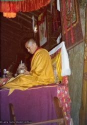 (15600_pr.tif) Lama Zopa Rinpoche doing a mandala offering. Photo from the 8th Meditation Course at Kopan Monastery, Nepal, 1975.