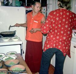 (15846_ng.psd) Lama Yeshe cooking, New York City, 1974. Photo shows Lama and Sylvia (maiden name unknown, later married Bo Sax) in the kitchen. In July 1974, the lamas and Mummy Max arrived in New York City to begin the first international teaching tour of Lama Yeshe and Lama Zopa Rinpoche. They stayed at the apartment of Lynda Millspaugh on the Upper West side of Manhattan.