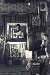 (15884_sl.psd) Photo of the lamas and sangha doing puja in the tent, Kopan Monastery, Nepal, 1974. For the Seventh Meditation Course a huge Indian wedding tent replaced the dusty burlap-walled tent.