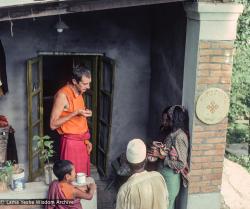 (16688_sl.tif) Adrian Feldmann (Ven Thubten Gyatso) treating local Nepali villagers outside the People's Clinic, Kopan Monastery, 1979.