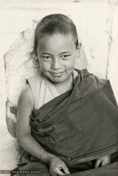 (16778_pr.psd) Thubten Lodro, a Mount Everest Center novice, Kopan Monastery, Nepal, 1976. Lama Yeshe sent photos of the MEC students all around the world and also took photos with him on tour in an attempt to raise funds for them. "Mummy" Max Mathews had a photo taken of each of them and had a group photo made into a poster.