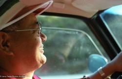 (23098_ng.tif) Lama Yeshe driving, probably in California, 1983. LYWA collection.