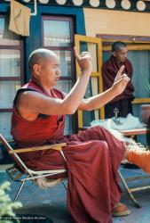 (34751_sl.jpg) Lama Yeshe enacts a ritual dance on the gompa terrace at Kopan Monastery, Kathmandu, Nepal, 1978. LYWA collection.