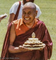 (39392_pr-3.psd) Lama Yeshe holding the cheesecake shaped like a mandala offered to him by Kalleen Mortensen at the teachings at Deer Park, Madison, Wisconsin, 1978. Morgan Groves (photographer)